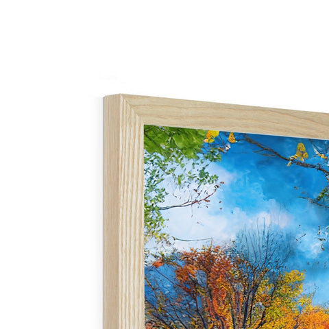 a photo frame with a photograph of trees and wooden furniture on it