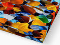A table filled with glass tile covered in different colors.