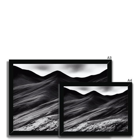 Four monitors have different black and white images on them.