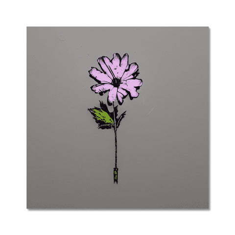 A little yellow flower and a pink carnation on the end of an aluminum plate.