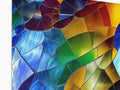 A large glass mosaic sculpture has three different colors of glass in it.