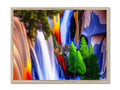 A picture frame with a blue and orange waterfall on it near a waterfall.