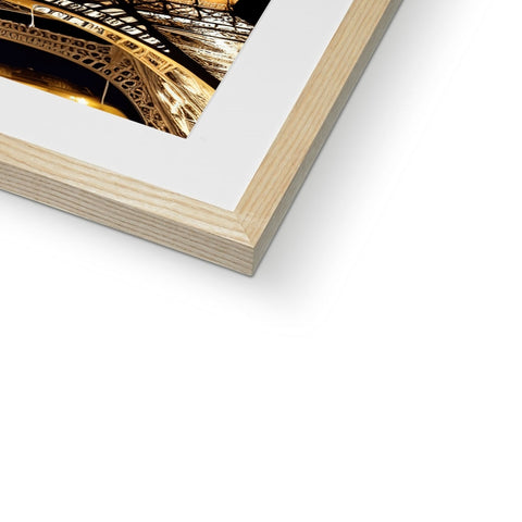 A white photo frame frame displaying a picture in gold framed on it's edge.