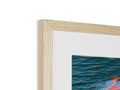 A photo framed in plastic is sitting on top of a box in a wood frame.