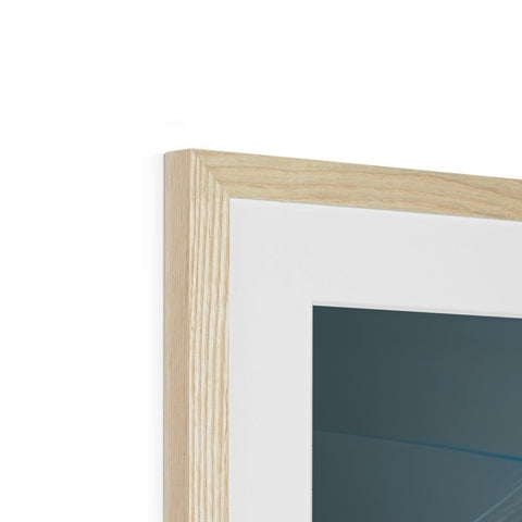 A picture frame with glass and wooden panels next to it sitting on a wall.