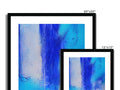 A blue picture of an abstract painting framed in picture frames attached to a large wooden wall