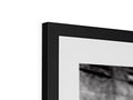 A picture frame of a television surrounded by a black and white picture frame.