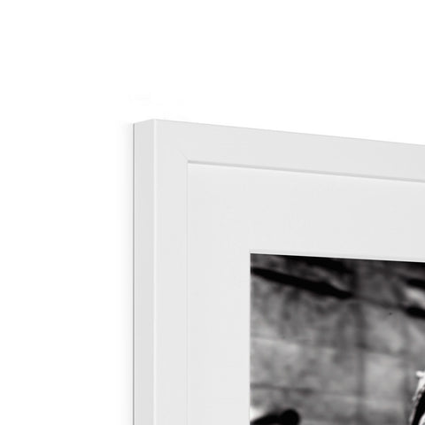 A picture plate is displayed on top of a picture frame in a black and white background