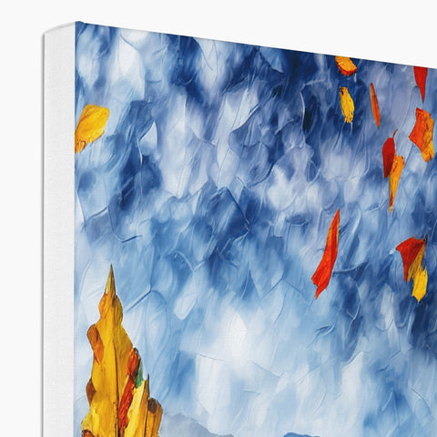 A softcover blanket with colorful pictures on it has a close up of fall leaves.