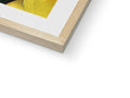 A framed photo of an art print sits on top of a wooden frame.