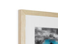A white wood frame with an image of an airplane in it.
