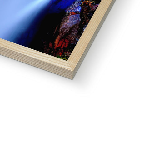 A picture frame with a blue  photo print that is decorated with colored artwork.