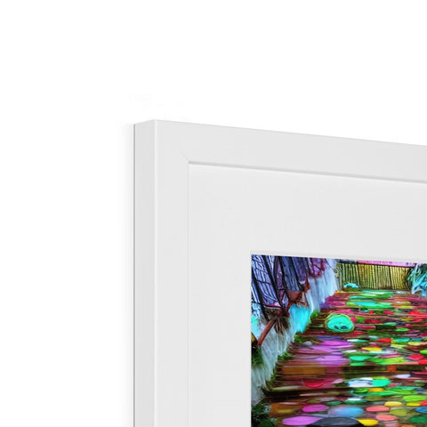 A blurred picture of a picture frame on a table with a colorful image of colorful light