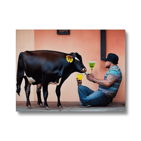The cow is standing next to a man while licking the milk.