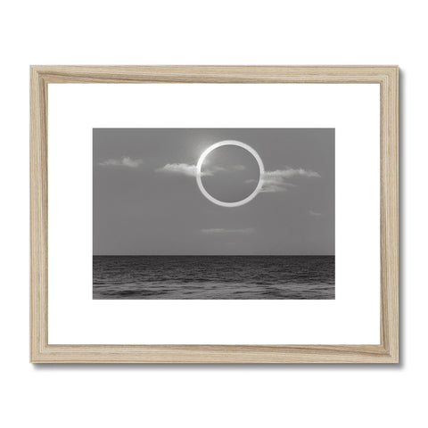 An art print that contains a photograph of a moon with clouds and a blue sky.