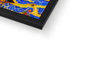 A metal picture frame with a tile art print with gold trim above and below it.