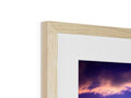 a picture frame that has a frame in white wood on it