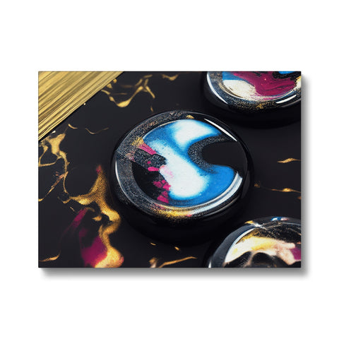 There are gold foil coasters on top of counter top with an acrylic art print in