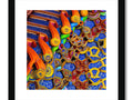 A photo of a wall hanging hanging hanging up in the living room with colorful artwork and