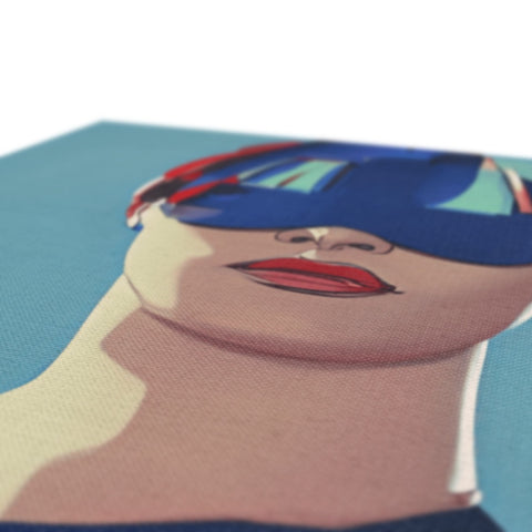 A soft printed art print on a pillow with a person wearing sunglasses on