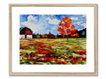 A picture of a farm farm surrounded in fall foliage on a wood frame.