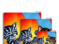 Four cats standing on tile table for a greeting card with their heads facing a wall.