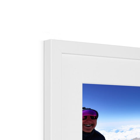 A picture frame containing a large framed picture on a small flat screen monitor.