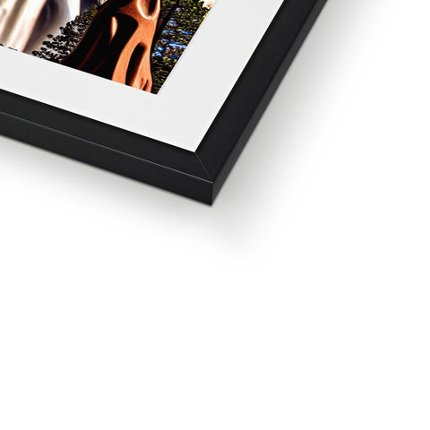 A picture frame with a close-up of a photo on a white table.
