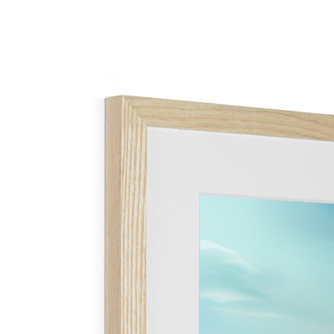 Picture of a blue and white frame in a wood frame.