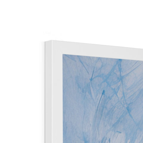 A blue and white art print sitting on a shelf in a bookcase.