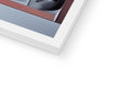 A white book that is showing a close up of a polaroid camera