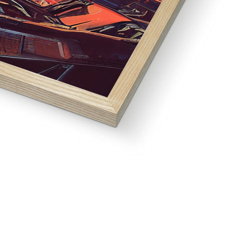 An image of an art book with a wooden frame next to it.