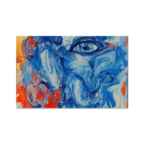 Art print showing a face on a sheet of paper with blue and red paints.