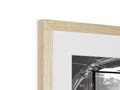A wooden photo frame that holds a beautiful hand print inside the white frame.