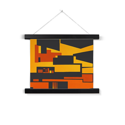 A glass frame hanging on the back of a wall with a black and orange print