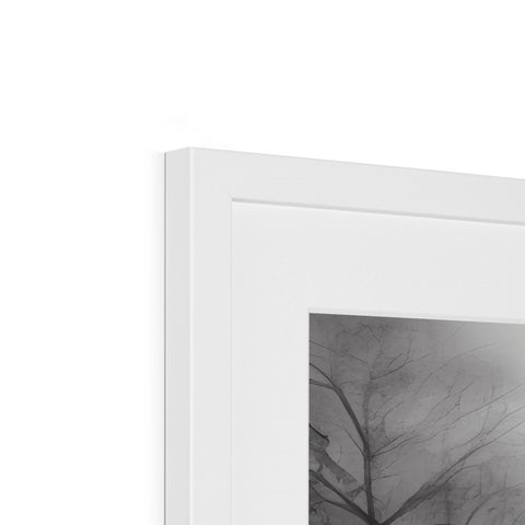 A photo of a hand with a tree in it in a silver framed frame.