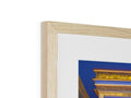 a picture frame standing on top of an antique fireplace with a blue and white picture frame