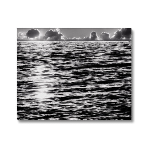 The ocean is shown on a picture framed in black and white.
