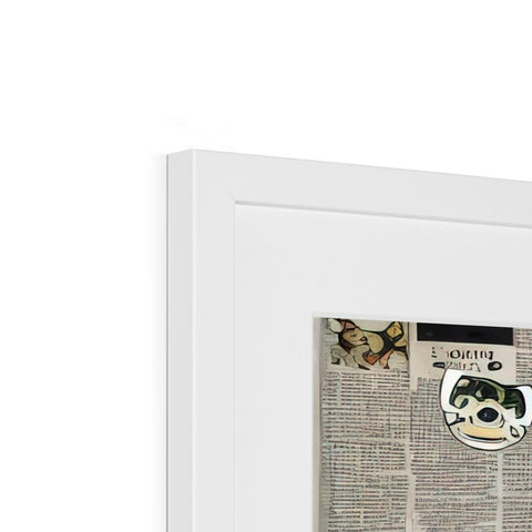 A mirror with paper cut out with a close up of newspaper and a magnet next to