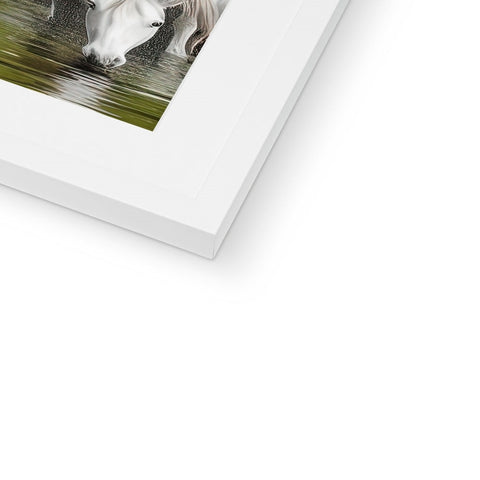 A pinto horse sitting on a white photo frame.