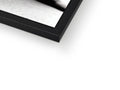 A picture frame with a small close up of a photograph and a black picture next to