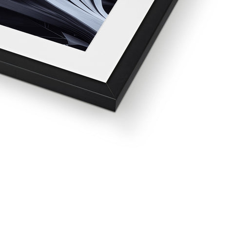 A white picture frame above a photo laying on a silver wall.