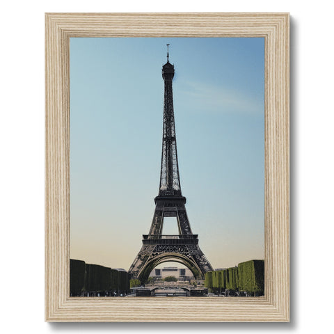 a wooden frame featuring a picture of an eiffel tower with a blue frame and