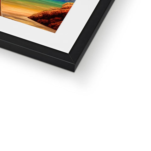 A framed photo sitting on top of a white and black frame.