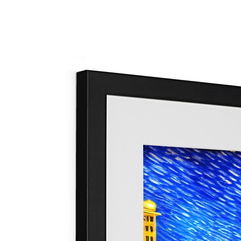 a picture frame with art print on it in front of the top of the LCD screen
