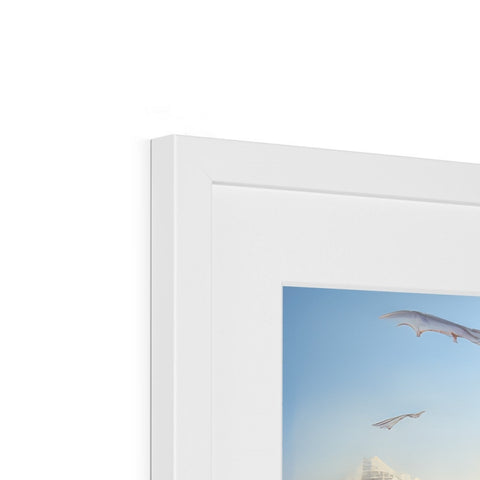 a picture made of a small white bird on a wall on the picture frame