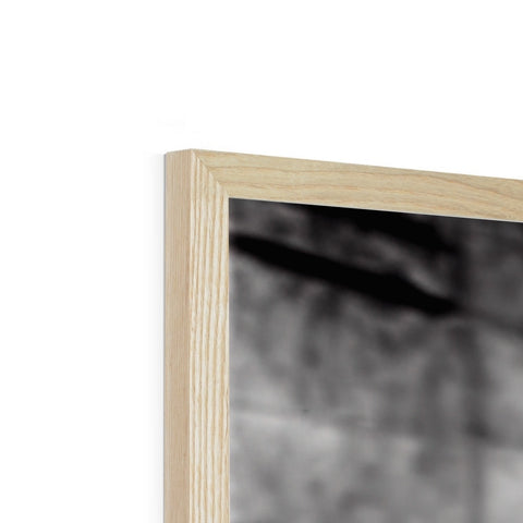 A wooden frame for a photograph has a pinhole to stand up in it.
