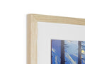 A piece of wood that some art is shown on in on a white photo frame.