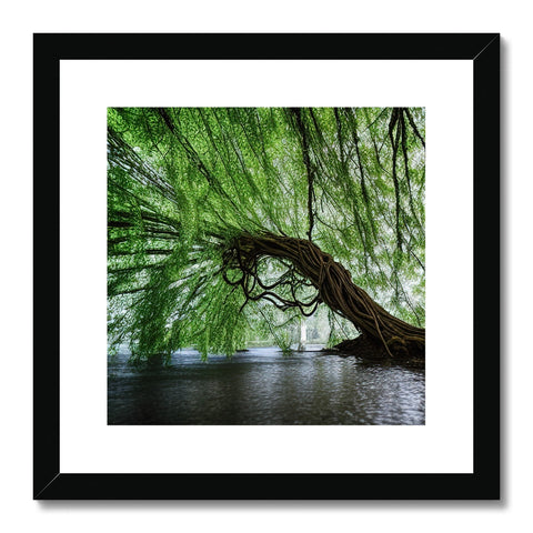 a silver art print that is hung above a tree and a body of water in a