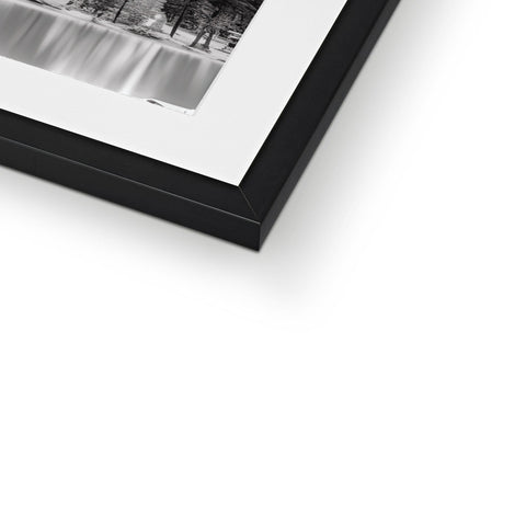 A picture of a black and white photo on a blue framed frame.